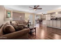 Inviting living room featuring hardwood floors and comfortable seating arrangement at 1133 N 84Th Pl, Scottsdale, AZ 85257