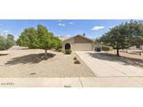 Charming single-story home with xeriscaped front yard and attached two-car garage at 15637 N 54Th St, Scottsdale, AZ 85254