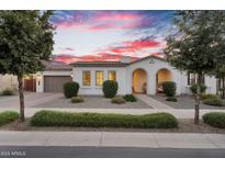 Charming single-story home with landscaped front yard and attached two-car garage, perfect for suburban living at 19428 S 210Th Pl, Queen Creek, AZ 85142