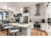 Modern kitchen with stainless steel appliances and open layout to the living area at 3131 N Central Ave # 7004, Phoenix, AZ 85012
