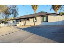 Charming single-story home with freshly painted exterior and well-maintained landscaping at 3421 W Montecito Ave, Phoenix, AZ 85017
