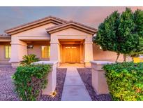 Inviting home entrance with double doors, manicured landscaping and a warm, welcoming ambiance at 3531 E Norwood Cir, Mesa, AZ 85213
