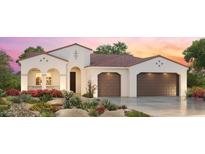 Elegant, single story home with a terracotta roof, a lush front yard, and a convenient two-car garage at 3566 N 166Th Dr, Goodyear, AZ 85395