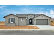 Charming single-story home featuring a neutral color palette, well-manicured yard, and an attached two-car garage at 4227 W Adobe Dr, Eloy, AZ 85131