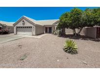 Charming single-story home featuring desert landscaping and a two-car garage at 4332 E Stanford Ave, Gilbert, AZ 85234