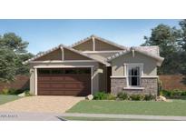 Charming single-story home featuring a two-car garage and manicured lawn at 4963 S 233Rd Dr, Buckeye, AZ 85326