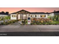 Beautifully landscaped, updated single-Gathering home with inviting front porch at 8708 E Rancho Vista Dr, Scottsdale, AZ 85251