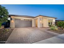 Charming one-story home featuring a brick driveway and desert landscaping at 13330 W Milton Dr, Peoria, AZ 85383