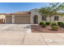 Charming single-story home with a three car garage, desert landscaping, and a tile roof at 259 E Montego Dr, Casa Grande, AZ 85122
