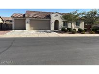 Charming single-story home with a well-maintained front yard and a spacious three-car garage at 259 E Montego Dr, Casa Grande, AZ 85122