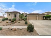 Charming single-story home featuring a three-car garage and low-maintenance desert landscaping at 32020 N 20Th Dr, Phoenix, AZ 85085