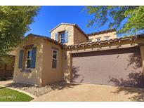 Charming home showcasing two-car garage, desert landscaping, and a blend of stone and stucco at 3581 S Arizona Pl, Chandler, AZ 85286