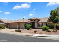 Charming single-story home with well-maintained landscaping and a tiled roof at 4223 E Danbury Rd, Phoenix, AZ 85032