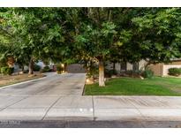 Charming home exterior with lush landscaping and a spacious driveway at 5139 S Marble St, Gilbert, AZ 85298