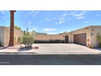 Charming single-story home with landscaped front yard, driveway, and an attached garage at 1131 N Cherry --, Mesa, AZ 85201