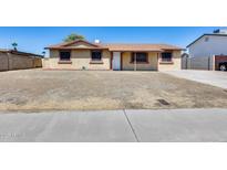 A single-story home featuring a tidy front yard and neutral-toned exterior at 12602 N 38Th Ave, Phoenix, AZ 85029