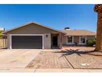 Charming single-story home featuring a well-maintained yard and a convenient two-car garage at 1352 W Naranja Ave, Mesa, AZ 85202