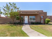 Charming single-story home with landscaped front yard and inviting walkway to the front door at 1439 N 53Rd Ave, Phoenix, AZ 85043