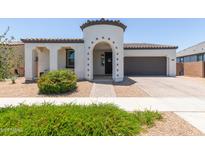 Charming single-Gathering home featuring a barrel tile roof, desert landscaping, and an attached two-car garage at 22853 E Calle Luna --, Queen Creek, AZ 85142