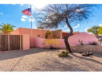 Charming single story home featuring desert landscaping, a courtyard, and a gated entrance at 2843 E Captain Dreyfus Ave, Phoenix, AZ 85032