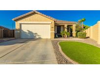 Charming single-story home featuring a two-car garage and desert landscaping at 3532 W Mesquite Ave, San Tan Valley, AZ 85144