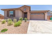 Charming single-Gathering home with a well-manicured front yard, a two-car garage, and stone masonry at 4371 E Enmark Dr, San Tan Valley, AZ 85143