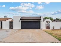 Charming single-story home with a spacious driveway and a two-car garage at 5343 W Vogel Ave, Glendale, AZ 85302