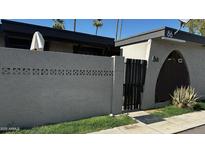 Charming single-story home featuring unique architectural details and a private courtyard entrance at 830 S Dobson Rd # 86, Mesa, AZ 85202