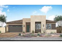 Contemporary single-story home with desert landscaping, attached garage and modern curb appeal at 2594 E Tapenade Dr, San Tan Valley, AZ 85140