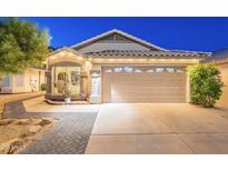 Charming single story home features a manicured lawn and attached two car garage at 3404 E Lavey Ln, Phoenix, AZ 85032