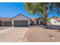 Charming single-story home featuring a well-manicured lawn, desert landscaping, and a two-car garage at 3608 W Fairview Ln, Chandler, AZ 85226