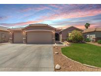 Charming single-story home with a three-car garage, manicured lawn, and desert landscaping at 3717 E Elmington Cir, San Tan Valley, AZ 85140