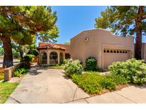 Charming home featuring well maintained desert landscaping, two car garage and a turret style living area at 4135 E Altadena Ave, Phoenix, AZ 85028