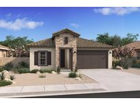 Inviting single-story home featuring a stone facade, a two-car garage, and desert landscaping for low maintenance at 42515 W Peters Dr, Maricopa, AZ 85138