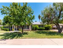 Charming single story home featuring a well maintained lawn, mature trees, and manicured landscaping at 840 E 2Nd St, Mesa, AZ 85203