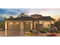 Beautiful single-Gathering home featuring a neutral palette, stone accents, three-car garage, and thoughtfully designed desert landscaping at 16578 W Mulberry Dr, Goodyear, AZ 85395
