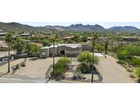 Stunning aerial view of a custom home with desert landscaping and mountain views at 38709 N 16Th Pl, Phoenix, AZ 85086