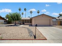 Charming single story home with a two-car garage and low maintenance landscaping at 5227 W Acapulco Ln, Glendale, AZ 85306
