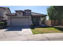 Charming single-story home featuring a 2-car garage and a cozy front porch at 6908 S 54Th Ln, Laveen, AZ 85339