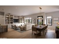 Open-concept living room features modern decor, built-in shelving, and natural light at 19360 N 73Rd St # 1081, Scottsdale, AZ 85255