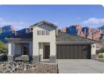 Modern single-story home with a neutral color palette, a two-car garage, and stunning mountain views at 2325 S 125Th Dr, Avondale, AZ 85323