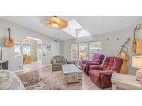 Inviting living room features lots of light and comfortable seating, perfect for relaxing and entertaining guests at 2400 E Baseline Ave # 44, Apache Junction, AZ 85119