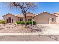 Charming single-story home with a well-manicured desert landscape and tile roof at 5372 S Cat Claw Dr, Gold Canyon, AZ 85118