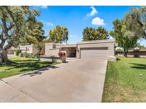 Charming single-story home with a two-car garage, mature trees, and a well-maintained front yard at 7832 E Via Marina --, Scottsdale, AZ 85258