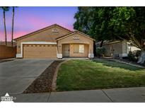 Charming single-story home with a well-maintained lawn, two car garage and inviting curb appeal at 1156 N San Benito Dr, Gilbert, AZ 85234