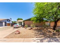 Charming single-story home with a well-maintained front yard and mature landscaping at 1509 E Verlea Dr, Tempe, AZ 85282