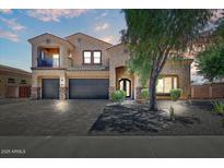 Charming two-story stucco home featuring a three-car garage and inviting curb appeal at 18207 W Sells Dr, Goodyear, AZ 85395