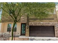 Stylish two-story home featuring stone accents and a two-car garage at 2000 N 36Th St # 35, Phoenix, AZ 85008