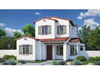 Charming two-story home with a red tile roof, shuttered windows, and beautifully landscaped front yard at 26433 N 22Nd Dr, Phoenix, AZ 85085