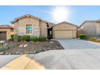 Charming home featuring desert landscaping and a neutral color palette at 23448 N 76Th Pl, Scottsdale, AZ 85255